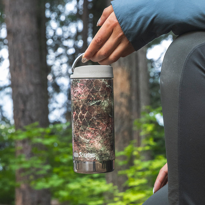 12oz-tkwide-with-twist-cap-mossy-oak-y2 12oz_tumbler_mossyoak_rainbowtrout_hand_closeup_square.jpg