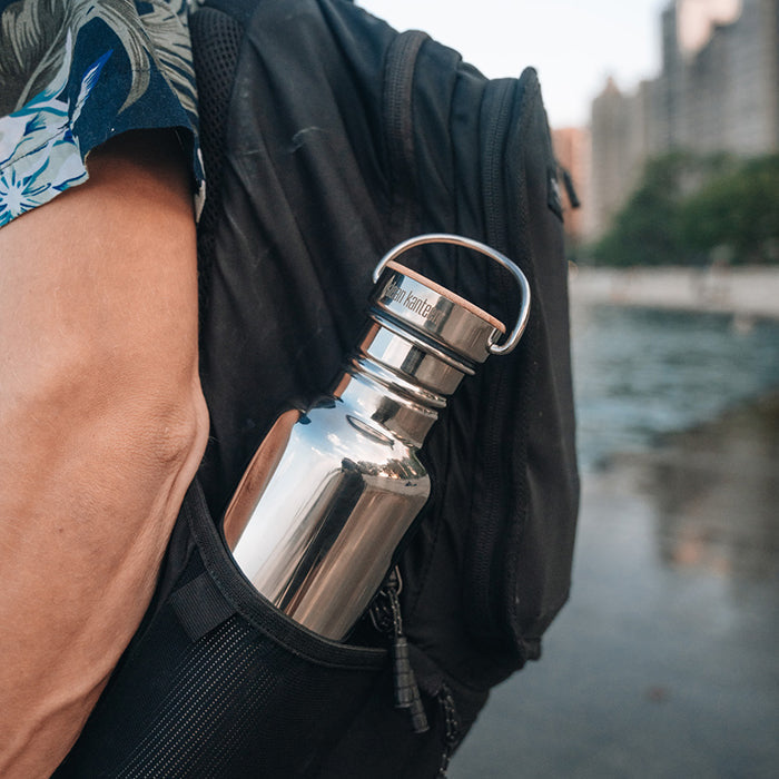 27oz-reflect-with-bamboo-cap-g3 K27SSLRF-MS-BAMBOO_reflect-bottle_backpack_lifestyle.jpg